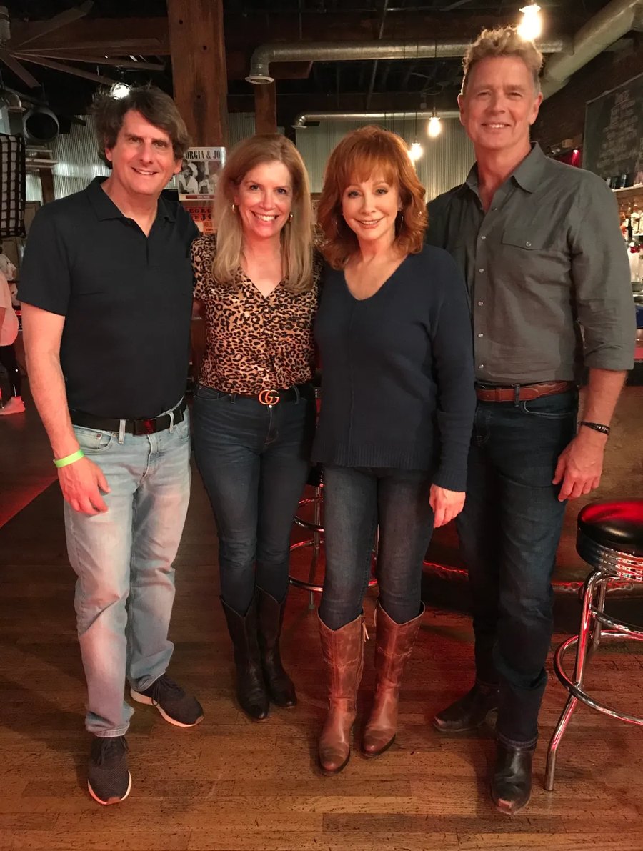 Juliet and Keith Giglio with Reba McEntire and John Schneider on the set of Christmas in Tune