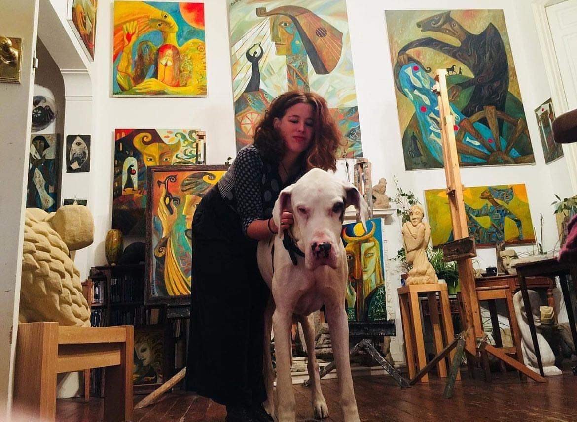 Andrea with a Great Dane in an artist&rsquo;s studio